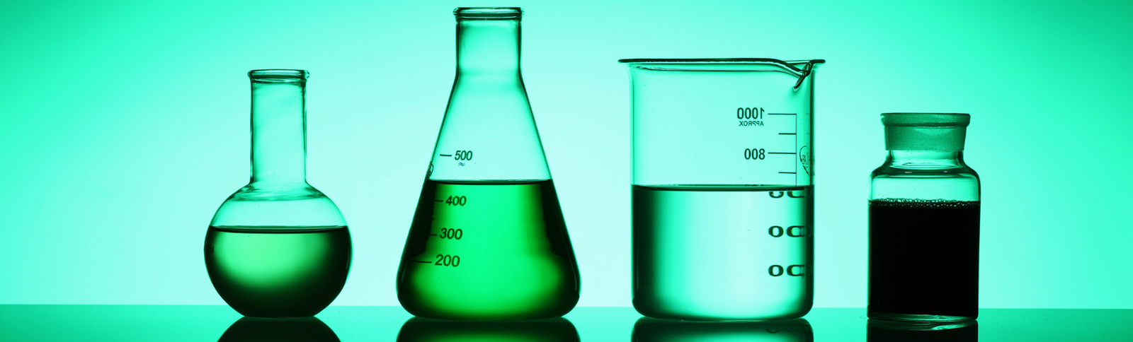 Scientific beakers and measuring jugs, representing a structured, experimental approach to testing new career directions.